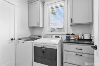 Great size utility room w/extra cabs & full closet. Love the natural light from the window