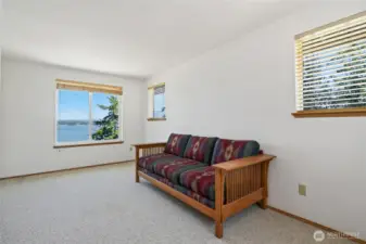 Upstairs bedroom # 2, is very spacious & also has lots of natural light with incredible water & mountain views.
