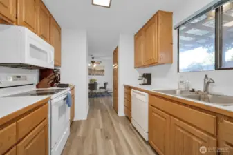 Bright and functional, connected to dining and living areas.