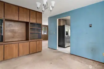 Dining room with door into kitchen on right.