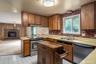 Looking into kitchen and family room beyond.