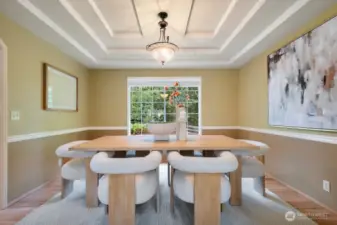 Formal dining room with Chair rail, inset ceiling treatment and duotone designer paint