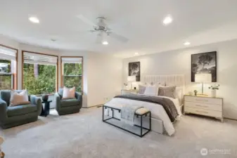 Relaxing spa-like primary suite with beautiful views of the greenbelt