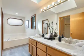 Spa-like primary suite bathroom with extra wide soaking tub
