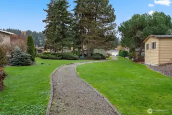 A quiet, gated community where neighbors wave, trails wind through the trees, and the clubhouse is always buzzing with something to do.