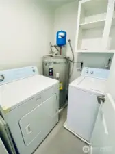 Brand new water heater located in the utility room.