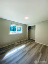 Spacious bedroom with all new flooring.