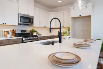 Kitchen - Pics are of a different 1785 plan. Features and colors may differ.