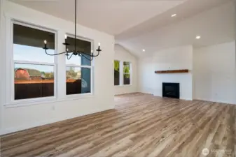 Dining area and living room - Pics are of a different 1785 plan. Features and colors may differ.