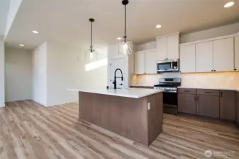 Kitchen - Pics are of a different 1785 plan. Features and colors may differ.