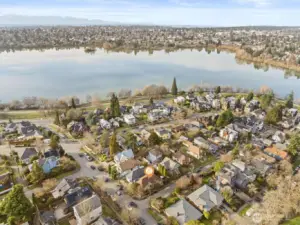 aerial photo looking west. Green Lake is just a couple of blocks away! Green Lake celebrated for its walkability. Whether you're strolling to the lake, visiting local shops, or enjoying the plethora of dining options, everything you need is within easy reach. Plus with Amazon, UW, downtown and 520 only minutes away, the best of Seattle is at your doorstep.