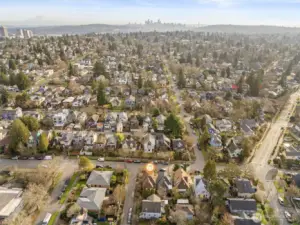 aerial photo looking south. You can see the skyscrape of downtown Seattle. Green Lake is just a couple of blocks away! Green Lake celebrated for its walkability. Whether you're strolling to the lake, visiting local shops, or enjoying the plethora of dining options, everything you need is within easy reach. Plus with Amazon, UW, downtown and 520 only minutes away, the best of Seattle is at your doorstep.
