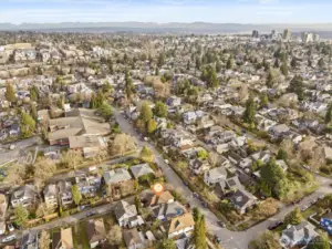 aerial photo looking east. Green Lake is just a couple of blocks away! Green Lake celebrated for its walkability. Whether you're strolling to the lake, visiting local shops, or enjoying the plethora of dining options, everything you need is within easy reach. Plus with Amazon, UW, downtown and 520 only minutes away, the best of Seattle is at your doorstep.