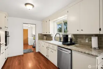 From the kitchen you have easy access to the laundry room with a newer hot water heater and a door to a walk-in pantry.