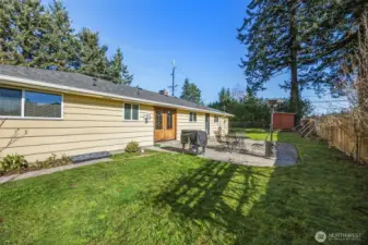 Private backyard with French doors from the dining room/kitchen area. Also garden shed and/or chicken coop + cover dry wood storage.