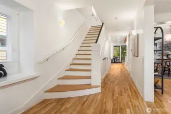 Soaring ceilings create an airy, welcoming ambiance throughout the main level.