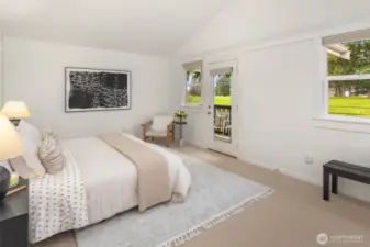 Relaxing retreat! Primary bedroom with deck overlooking the golf course.