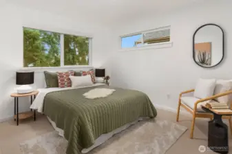 One of 3 additional bedroom on the upper floor. This overlooks the private yard.