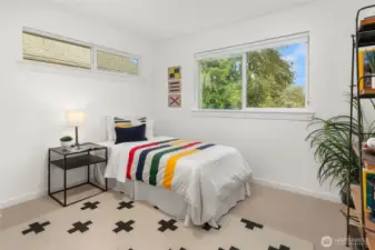 One of 3 additional bedroom on the upper floor. This overlooks the private yard.