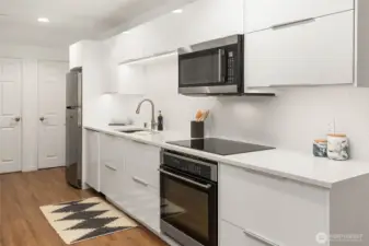 Modern galley kitchen in the lower level.