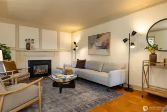 Gas fireplace and original picture rail molding for hanging art.