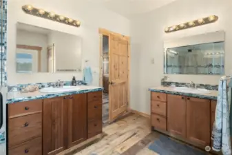 Double sinks, vanity in the primary bath with lots of elbow room.