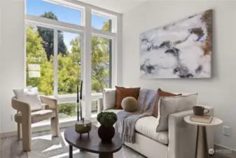 Floor to ceiling windows look out to a beautiful tree lined street for privacy.