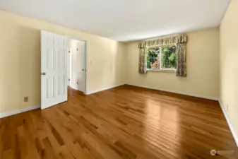 Large bedroom with lots of sunlight.