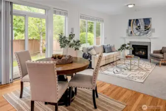 The sunny nook is connected to the family room with a cozy gas fireplace.