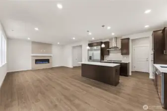 Another great view of the great room from the dining area.  Actual home is under construction and materials, colors, and finishes will vary. See site agent for details.