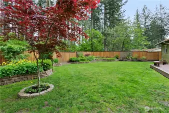 Nearly 1/4 acre flat lot with impeccable lanscaping