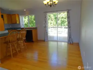 Dining Room With Deck Off The Slider. Oak Hardwood Flooring.