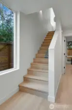 Bright entry leads up to main living level
