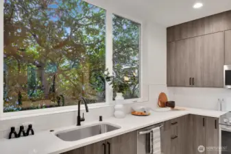 Kitchen backs up to soft natural outlook