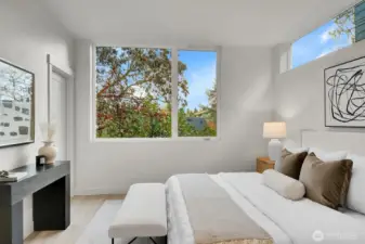 Comfortably sized Primary Bedroom Suite with walk in closet