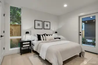 Ground level bedroom or study with double wardrobe closet and door to exterior patio