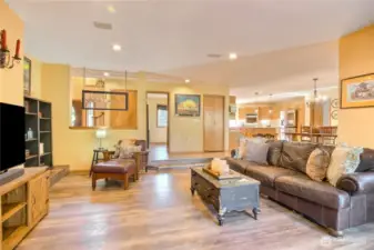 Sunken in living room with wood burning fireplace.