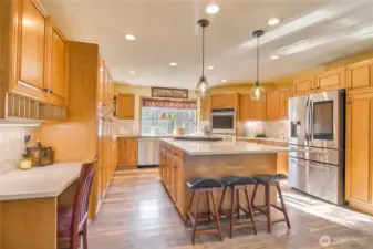 Gourmet kitchen features stainless steel appliances