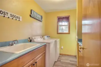 Laundry room with a half bath and mudroom are off the kitchen.