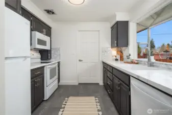 Updated kitchen featuring large garden window.