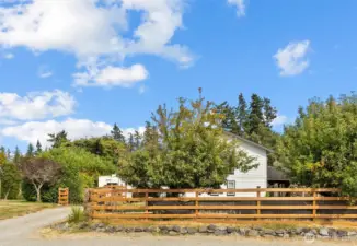 Fenced yard, fruit trees, privacy, and extra parking!