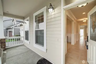 Charming front porch and inviting entry set the tone for this beautiful home.