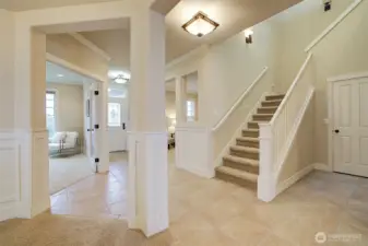 Beautiful foyer showing stairs leading to the upstairs.