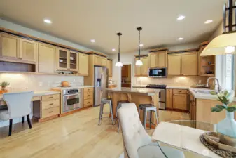 Very large and functional kitchen with island seating.