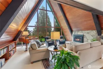 Beautiful living room with TALL T&G ceilings, a full wall of windows, and cool beams.