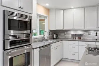 Updated kitchen with stainless steel and lots of storage.