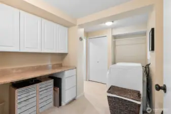 Large laundry room with lots of storage.