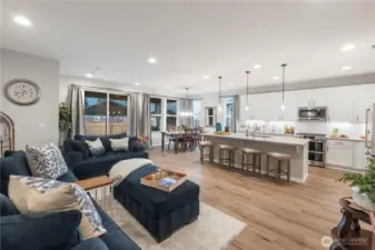 Great room style living space is warm, inviting and a fun space for entertaining.