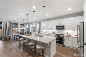 Must see to appreciate this stand-our kitchen, full of upgrades and improvements in every inch. Pull-out shelves EVERYWHERE, cabinet-height backsplash, double-oven and so many other purchase upgrades COMBINED with seller improvements even AFTER purchase.