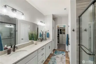 Owner's bathroom suite is beautiful with quartz counters, undermount sinks, oversized tiled shower and huge walk-in closet. Remember, this home is larger than many detached homes, and this owner's suite shows off with large spaces, including a secluded (separate and enclosed) water closet.